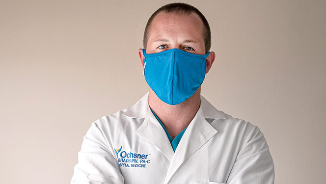 Male Ochsner Physicians Assistant wearing blue face mask