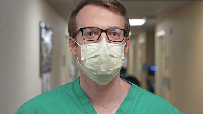 Male Ochsner doctor wearing face mask